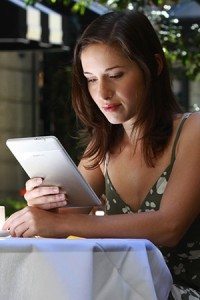 Woman reading Kindle